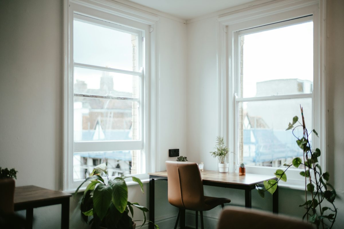 A living room with a large window and soft daylight.